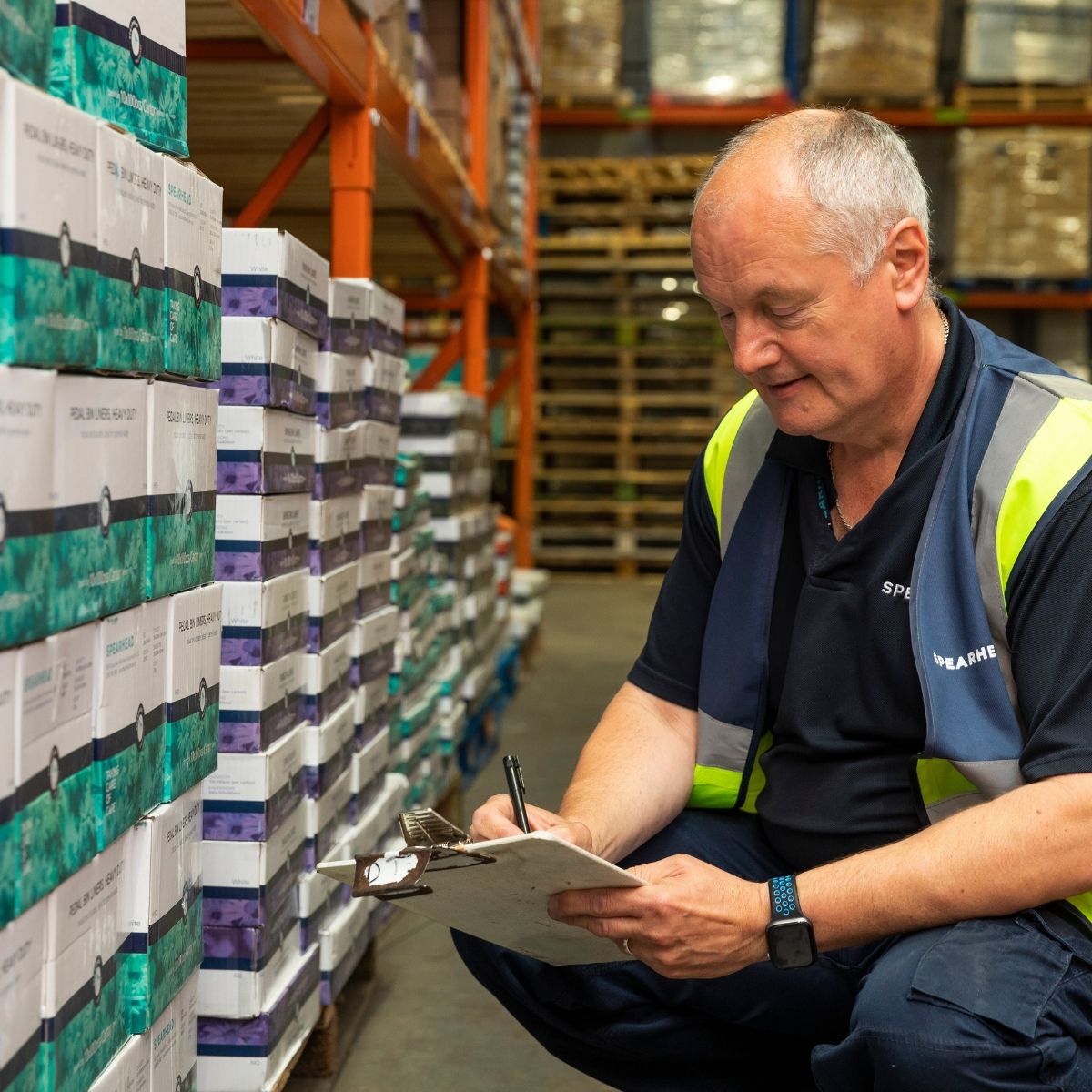 warehouse operative checking stock